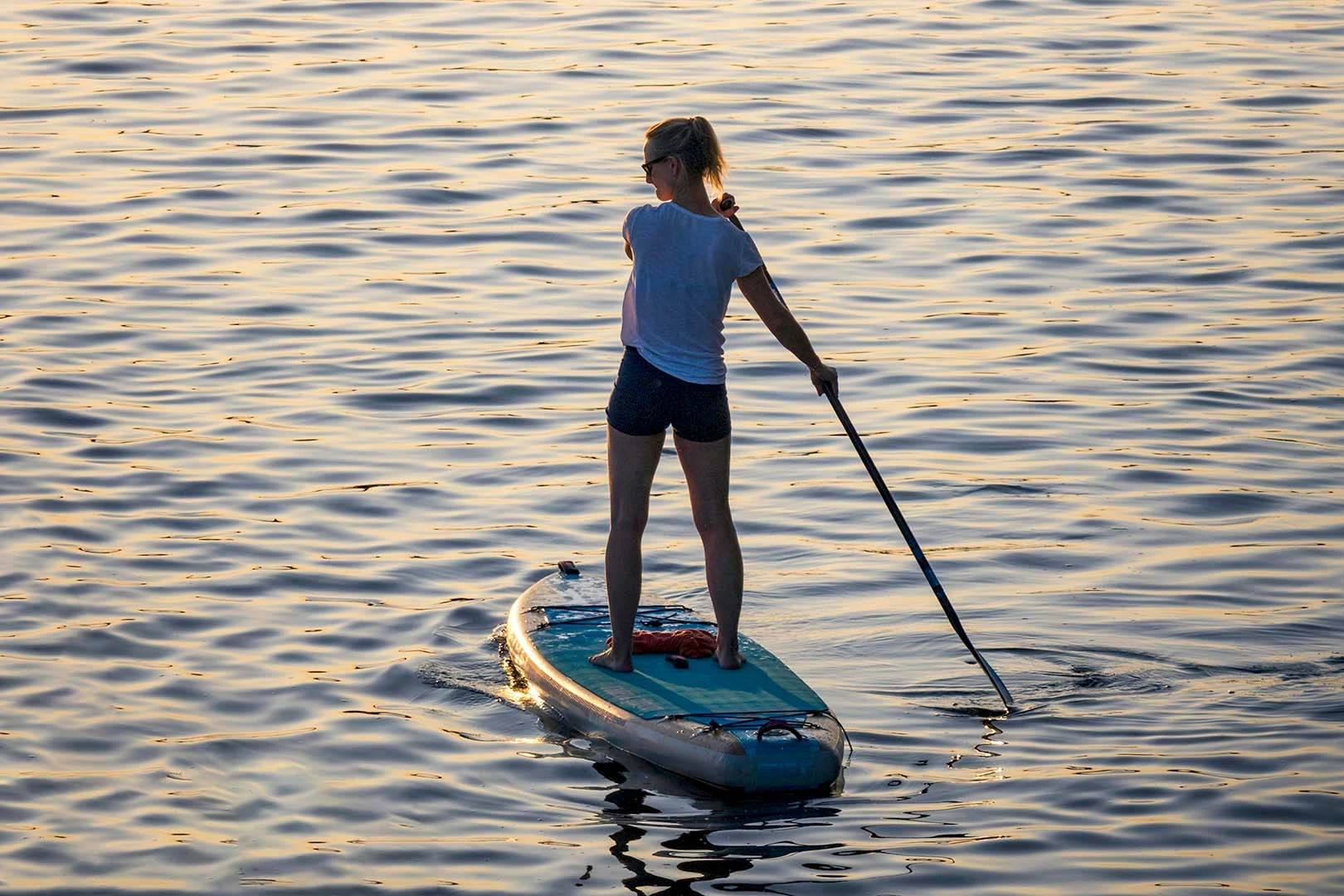 a women on a sup board